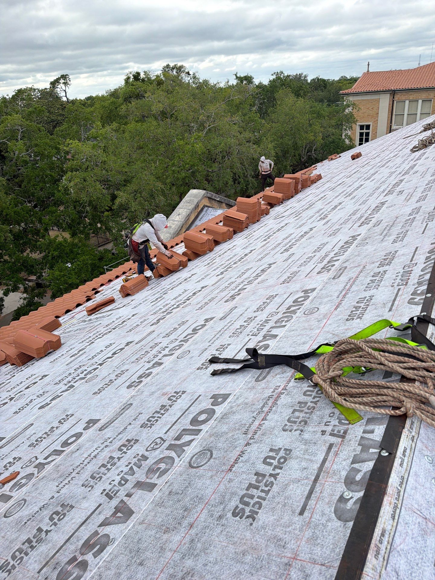 JT Brothers team collaborating on a roofing project